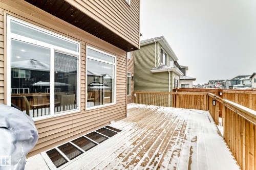 Wooden deck featuring area for grilling and a residential view - 5110 23A Avenue, Edmonton, AB - Outdoor With Deck Patio Veranda