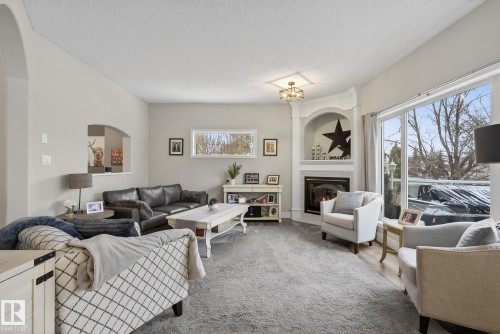 121 Galland Crescent, Edmonton, AB - Indoor Photo Showing Living Room With Fireplace