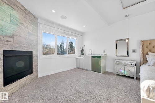 14643 92A Avenue, Edmonton, AB - Indoor Photo Showing Bedroom With Fireplace