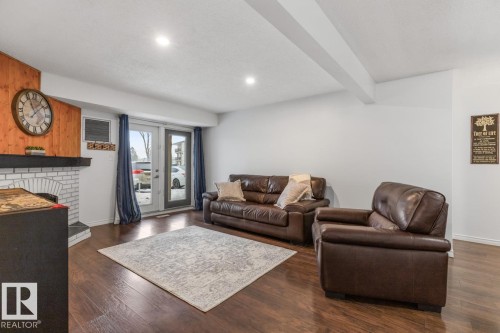 103 10528 29 Avenue, Edmonton, AB - Indoor Photo Showing Living Room With Fireplace