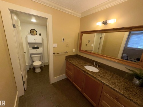 Vanity outside of bathroom - 102 11303 103 Avenue, Edmonton, AB - Indoor Photo Showing Bathroom