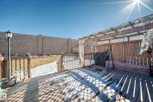 Wooden deck featuring a fenced backyard, a grill, and a pergola - 3059 Checknita Way, Edmonton, AB - Outdoor With Deck Patio Veranda