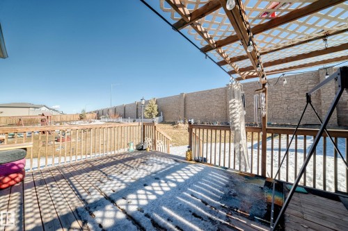 Wooden deck featuring a fenced backyard - 3059 Checknita Way, Edmonton, AB - Outdoor With Deck Patio Veranda