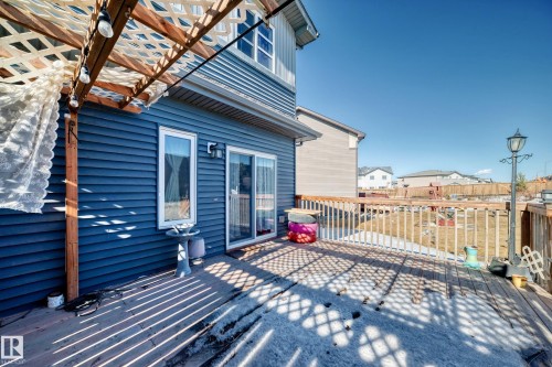 Wooden terrace featuring a residential view - 3059 Checknita Way, Edmonton, AB - Outdoor With Deck Patio Veranda