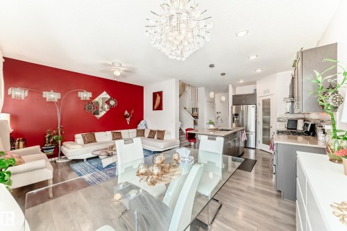 Dining space with light wood finished floors, suspended lighting, and a ceiling fan - 3059 Checknita Way, Edmonton, AB - Indoor