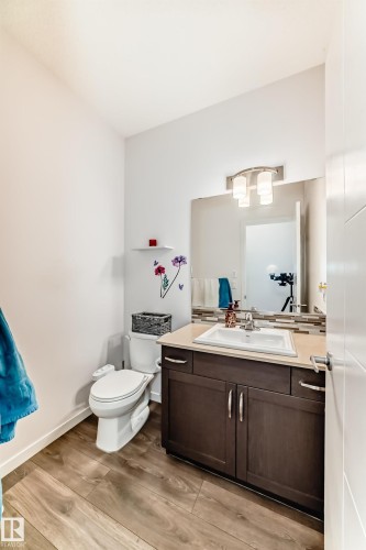 Bathroom with vanity and light wood-style flooring - 3059 Checknita Way, Edmonton, AB - Indoor Photo Showing Bathroom