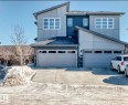 View of front of property with roof with shingles, driveway, and stone siding - 3059 Checknita Way, Edmonton, AB  - Outdoor 