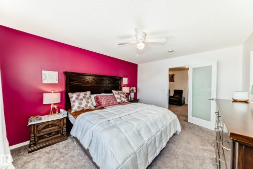 Bedroom featuring light colored carpet and ceiling fan - 3059 Checknita Way, Edmonton, AB - Indoor Photo Showing Bedroom