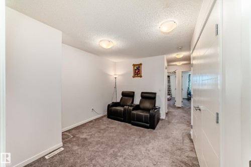 Sitting room featuring carpet flooring and a textured ceiling - 3059 Checknita Way, Edmonton, AB - Indoor Photo Showing Other Room