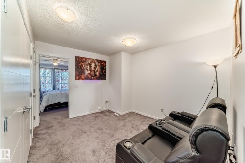 Unfurnished room with light colored carpet and a textured ceiling - 3059 Checknita Way, Edmonton, AB - Indoor Photo Showing Other Room