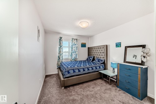 Bedroom with carpet floors and baseboards - 3059 Checknita Way, Edmonton, AB - Indoor Photo Showing Bedroom