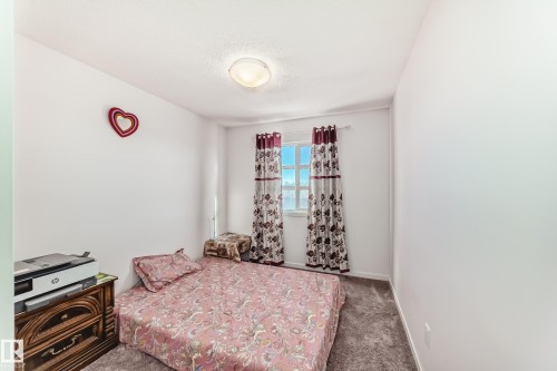 Bedroom featuring carpet flooring and a textured ceiling - 3059 Checknita Way, Edmonton, AB - Indoor Photo Showing Bedroom