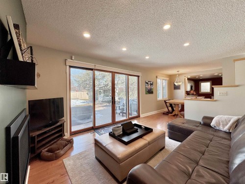 Family room with light wood-style floors, recessed lighting, and a textured ceiling - 4 Wolf Crescent Nw, Edmonton, AB - Indoor Photo Showing Living Room