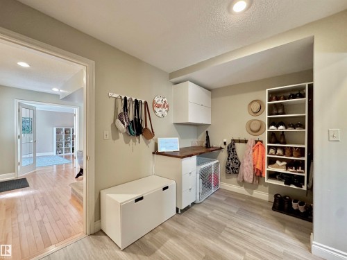 Mud room with white cabinetry, light wood-style floors, recessed lighting, a textured ceiling, and wooden counters - 4 Wolf Crescent Nw, Edmonton, AB - Indoor Photo Showing Other Room