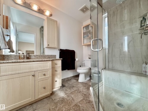Bathroom featuring vanity and a marble finish shower - 4 Wolf Crescent Nw, Edmonton, AB - Indoor Photo Showing Bathroom