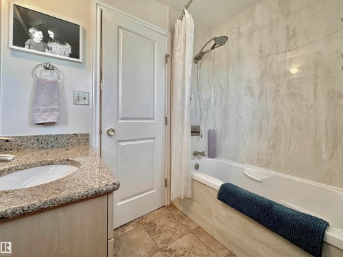 Full bathroom featuring shower / bath combination with curtain and vanity - 4 Wolf Crescent Nw, Edmonton, AB - Indoor Photo Showing Bathroom