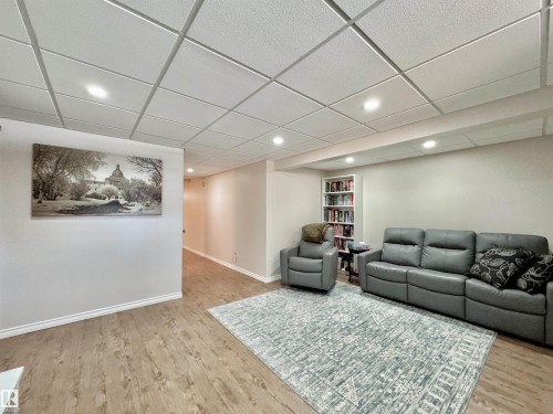 Living room with a drop ceiling, recessed lighting, and light wood-style flooring - 4 Wolf Crescent Nw, Edmonton, AB - Indoor