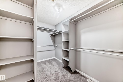 Walk in closet in primary bedroom. - 170 Blackburn Drive W, Edmonton, AB - Indoor With Storage