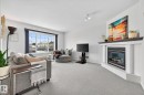 16 225 Blackburn Drive E, Edmonton, AB  - Indoor Photo Showing Living Room With Fireplace 