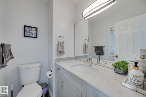 Half bathroom with vanity and toilet - 59 14803 Miller Boulevard, Edmonton, AB - Indoor Photo Showing Bathroom