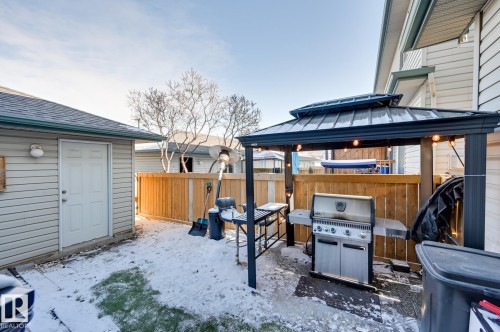 Fenced backyard with a gazebo and area for grilling - 59 14803 Miller Boulevard, Edmonton, AB - Outdoor With Deck Patio Veranda With Exterior