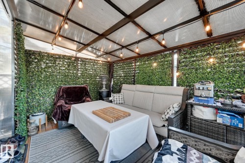 View of patio / terrace with an outdoor hangout area - 59 14803 Miller Boulevard, Edmonton, AB - Outdoor With Deck Patio Veranda With Exterior