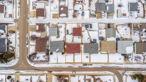 Aerial view of the property, featuring a red roof and a surrounding yard - 7911 145 Avenue Nw, Edmonton, AB - Other