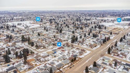 Aerial view of the neighborhood, showcasing residential properties with varying architectural styles, and a road network - 7911 145 Avenue Nw, Edmonton, AB - Outdoor With View