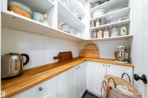 pantry off kitchen with built in cabinets - 8332 120 Street, Edmonton, AB - Indoor
