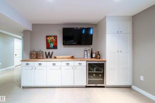 built in shelving and 2nd wine fridge in lower level family room/games room - 8332 120 Street, Edmonton, AB - Indoor