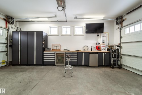 These portable shelves do not stay with the home - 8332 120 Street, Edmonton, AB - Indoor Photo Showing Garage