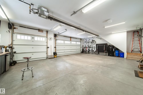 Garage is 8.3 x 11.24 meters or 27 x 36 ft. complete with 220 Watt EV charging station.  Floor is reinforced 5 inch solid concrete - 8332 120 Street, Edmonton, AB - Indoor Photo Showing Garage