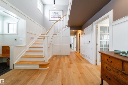 new engineer hardwood throughout main floor; with winding staircase leading to upstairs. - 8332 120 Street, Edmonton, AB - Indoor Photo Showing Other Room