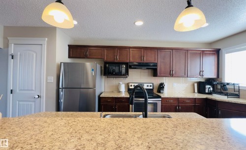 1542 33A Street, Edmonton, AB - Indoor Photo Showing Kitchen With Stainless Steel Kitchen With Double Sink