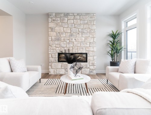 25 7121 May Crescent, Edmonton, AB - Indoor Photo Showing Living Room With Fireplace