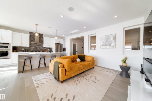 Living room with light wood-type flooring and recessed lighting - 19 Sturtz Place, Leduc, AB - Indoor