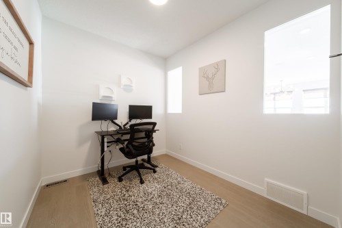 Office space featuring light wood finished floors and baseboards - 19 Sturtz Place, Leduc, AB - Indoor
