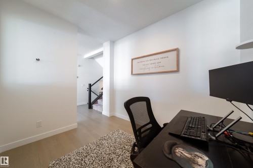 Office space with light wood-type flooring and baseboards - 19 Sturtz Place, Leduc, AB - Indoor Photo Showing Office