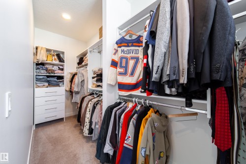 Walk in closet with light carpet - 19 Sturtz Place, Leduc, AB - Indoor With Storage