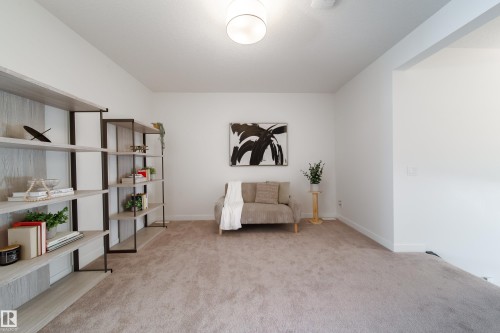 Sitting room with light colored carpet and baseboards - 19 Sturtz Place, Leduc, AB - Indoor
