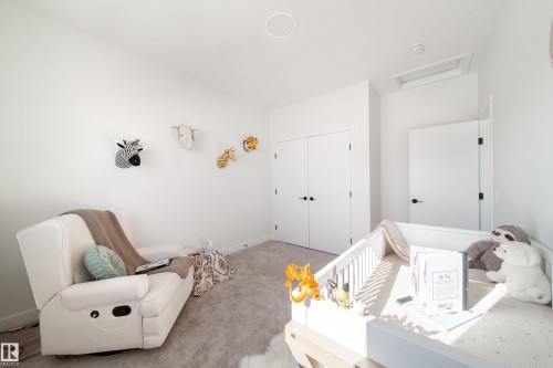 Bedroom featuring carpet flooring and a closet - 19 Sturtz Place, Leduc, AB - Indoor