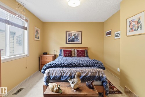 Bedroom featuring carpet and a textured ceiling - 8311 11 Avenue, Edmonton, AB - Indoor Photo Showing Bedroom