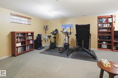 Workout area featuring light colored carpet - 8311 11 Avenue, Edmonton, AB - Indoor Photo Showing Gym Room