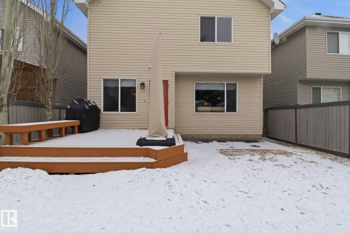 Snow covered rear of property featuring a deck - 8311 11 Avenue, Edmonton, AB - Outdoor With Exterior