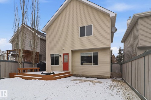 Snow covered house featuring a fenced backyard and a deck - 8311 11 Avenue, Edmonton, AB - Outdoor With Exterior