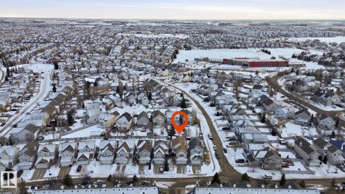 Aerial view of the neighborhood with snow-covered streets and rooftops - 8311 11 Avenue, Edmonton, AB - Outdoor With View