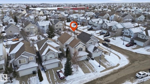 Aerial view of the residential neighborhood featuring houses with attached garages and paved driveways - 8311 11 Avenue, Edmonton, AB - Outdoor