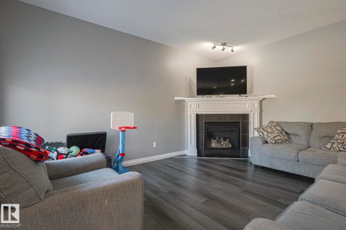 16 Hartwick Gate, Spruce Grove, AB - Indoor Photo Showing Living Room With Fireplace