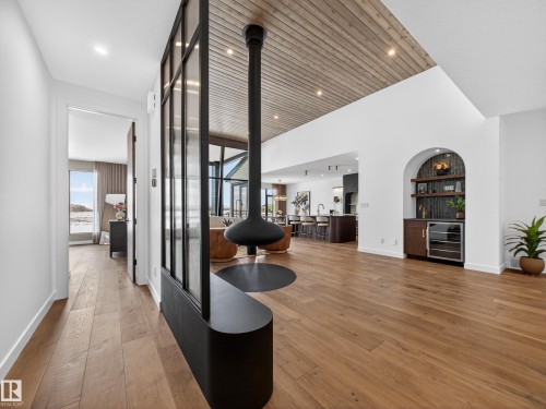 Hallway with hardwood / wood-style floors, wine cooler, and recessed lighting - 7104 54 Avenue, Beaumont, AB - Indoor Photo Showing Other Room