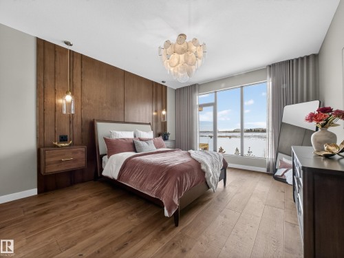 Bedroom with hardwood / wood-style floors and a water view - 7104 54 Avenue, Beaumont, AB - Indoor Photo Showing Bedroom